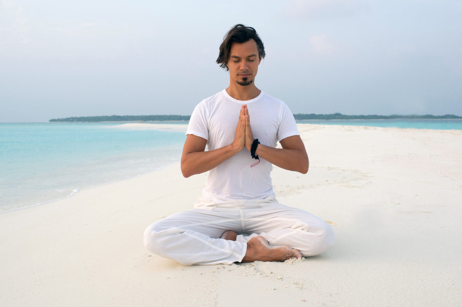 morning-meditation-sand-bank-soneva-fushi-hotel-maldives