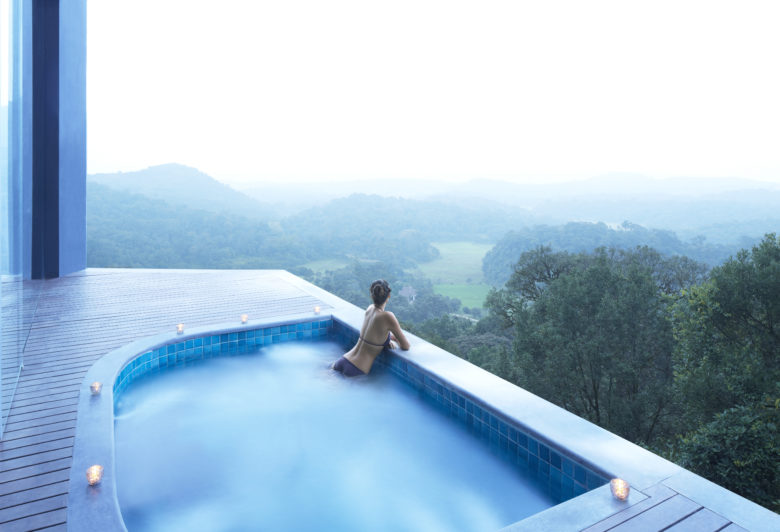 TVC_relaxing-Jacuzzi_woman-swimming-in-panoramic-outdoor-pool-with-view-over-green-nature-with-trees-and-forest-1.jpg